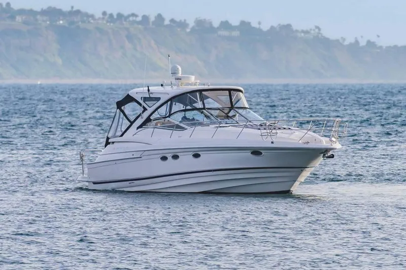 Slide: The Image of 2010 Regal Commodore 4460 yacht cruising on calm ocean waters. - 5