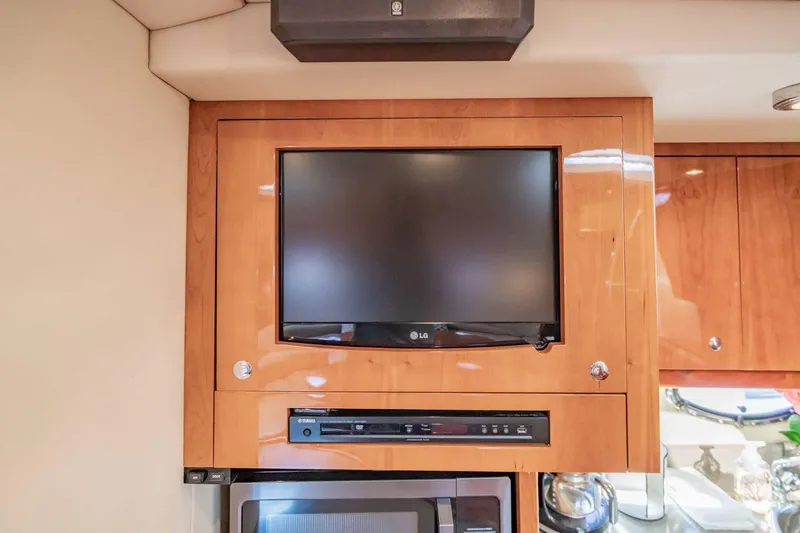 Slide: The Image of Built-in TV and audio system in 2010 Regal Commodore 4460 yacht interior. - 52