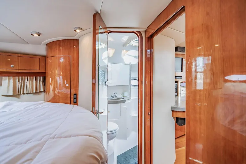 Slide: The Image of Luxurious interior of 2010 Regal Commodore 4460 yacht with wood finishes and modern amenities. - 57