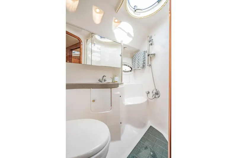 Slide: The Image of Luxurious bathroom in 2010 Regal Commodore 4460 yacht with modern fixtures. - 58