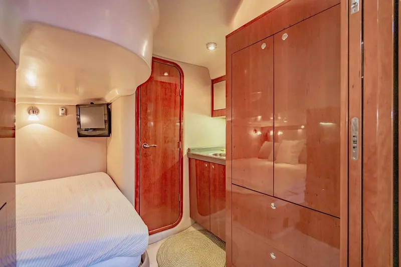 Slide: The Image of Luxurious cabin interior of 2010 Regal Commodore 4460 yacht with wood finishes. - 59