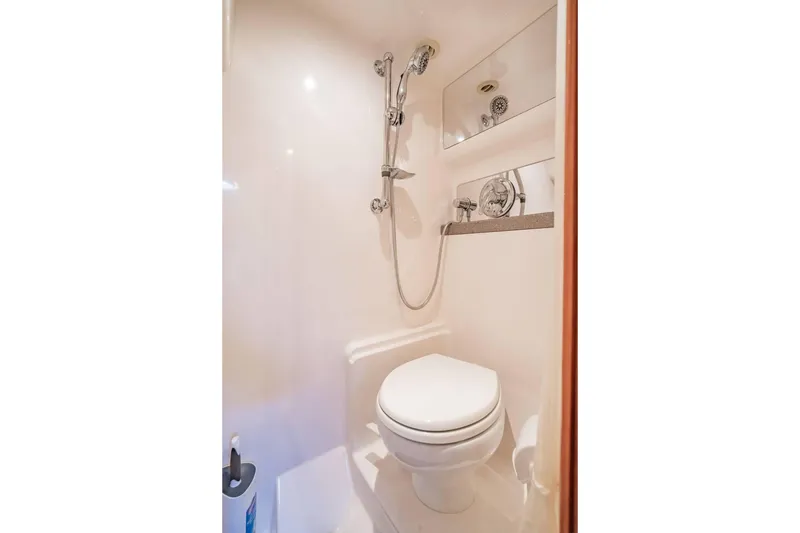 Slide: The Image of Compact bathroom in 2010 Regal Commodore 4460 yacht with shower and toilet. - 63