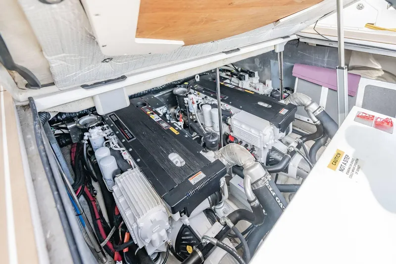 Slide: The Image of Engine compartment of a 2010 Regal Commodore 4460 boat, showcasing dual engines. - 65