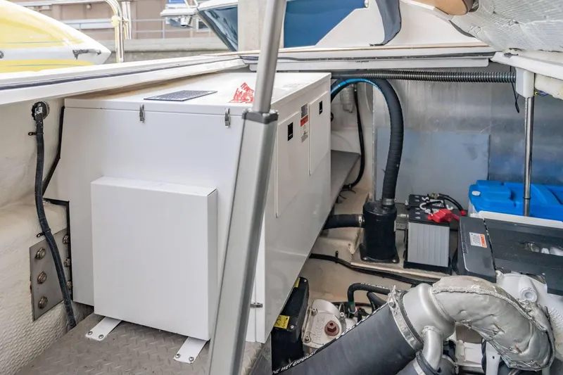 Slide: The Image of Engine compartment of a 2010 Regal Commodore 4460 boat, showcasing mechanical components. - 67