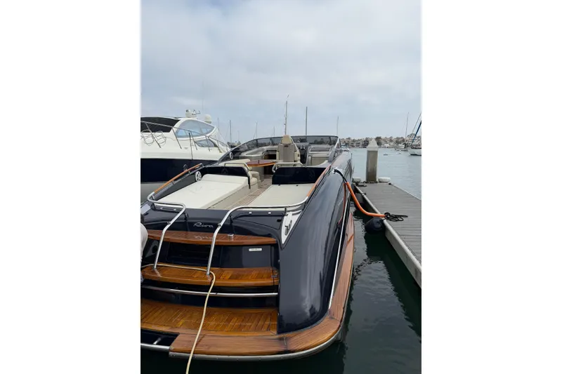 Slide: The Image of Luxurious 2012 Riva 44' Rivarama yacht docked at marina, showcasing sleek design and elegance. - 10