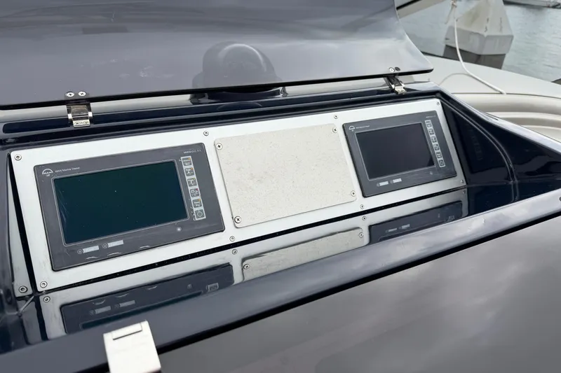Slide: The Image of Control panel of a 2012 Riva 44' Rivarama yacht with digital displays. - 12