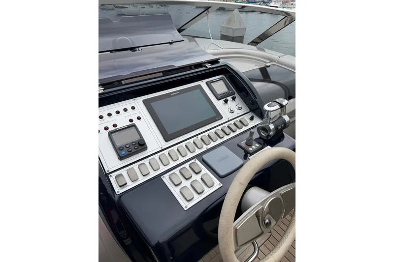Slide: The Image of Helm of 2012 Riva 44' Rivarama yacht with modern navigation controls. - 14