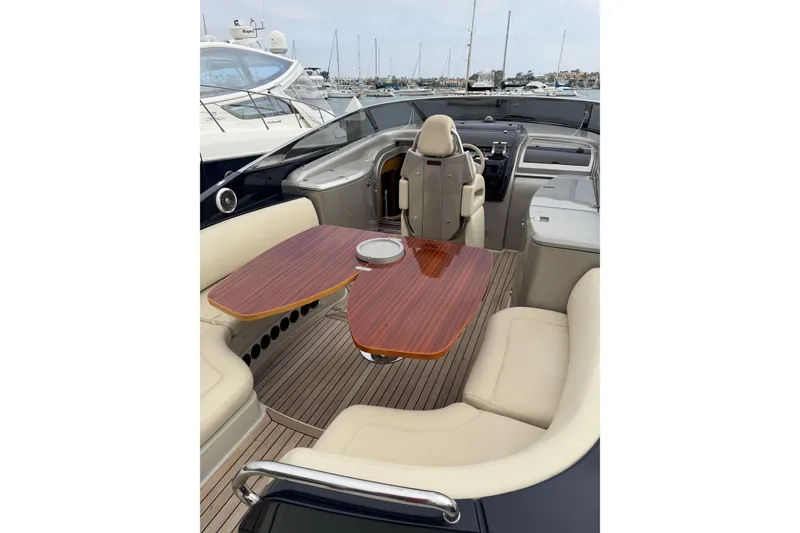 Slide: The Image of Luxurious 2012 Riva 44' Rivarama yacht interior with elegant seating and wooden table. - 15