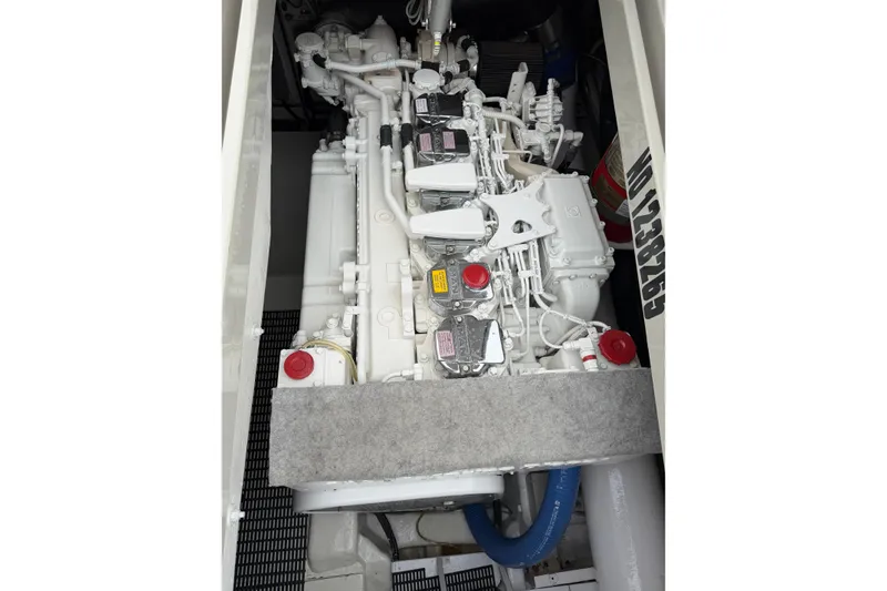 Slide: The Image of Engine compartment of a 2012 Riva 44' Rivarama yacht, showcasing detailed machinery. - 22