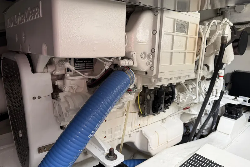 Slide: The Image of Engine compartment of a 2012 Riva 44' Rivarama yacht, featuring marine diesel components. - 24