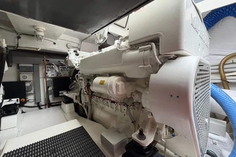 Slide: The Image of Engine room of a 2012 Riva 44' Rivarama yacht, showcasing detailed machinery. - 25