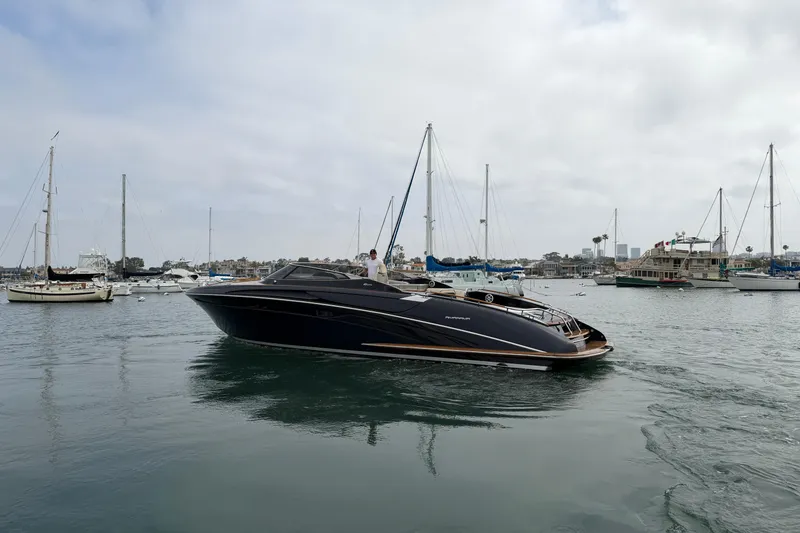 Slide: The Image of Luxurious 2012 Riva 44' Rivarama yacht cruising in a scenic marina setting. - 6