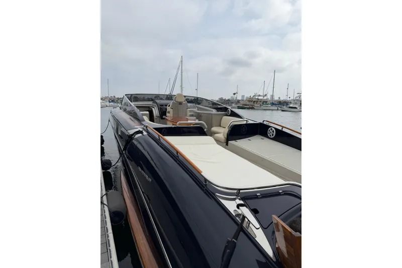 Slide: The Image of Luxurious 2012 Riva 44' Rivarama yacht docked in a serene marina setting. - 9