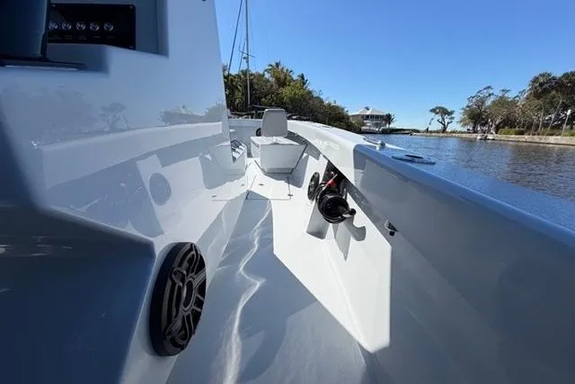 Slide: The Image of 2026 Orion 29 boat interior with sleek design, speaker, and serene waterfront view. - 14