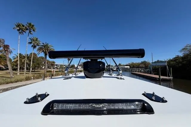 Slide: The Image of Front view of 2026 Orion 29 boat docked under clear blue sky. - 16