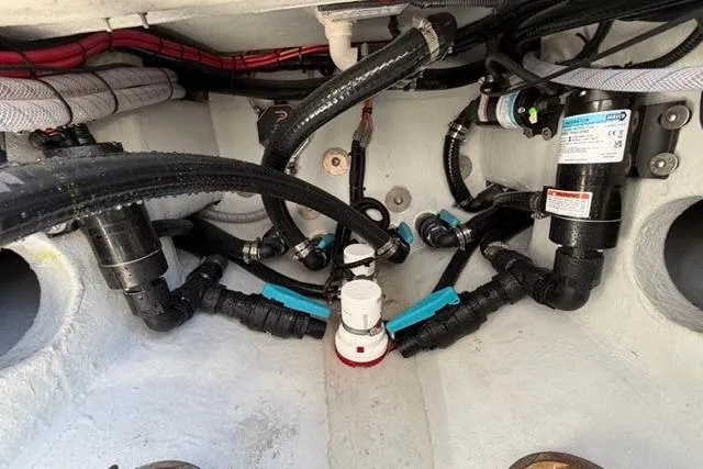 Slide: The Image of Boat engine compartment with hoses and wiring, Orion 29 model, 2026. - 18