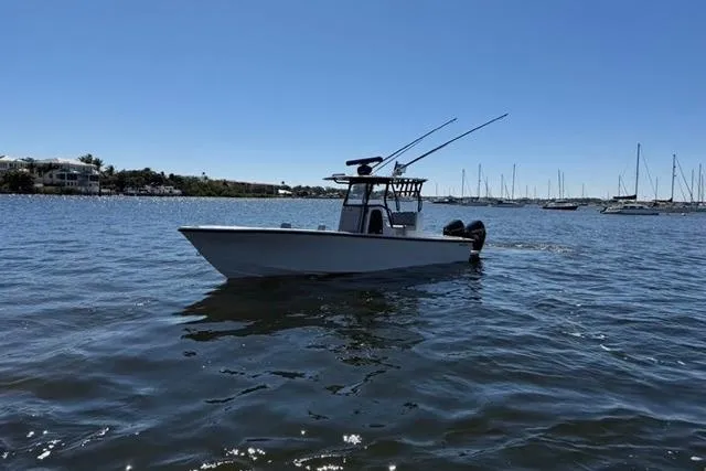 Slide: The Image of A 2026 Orion 29 boat on calm waters with a clear blue sky. - 19