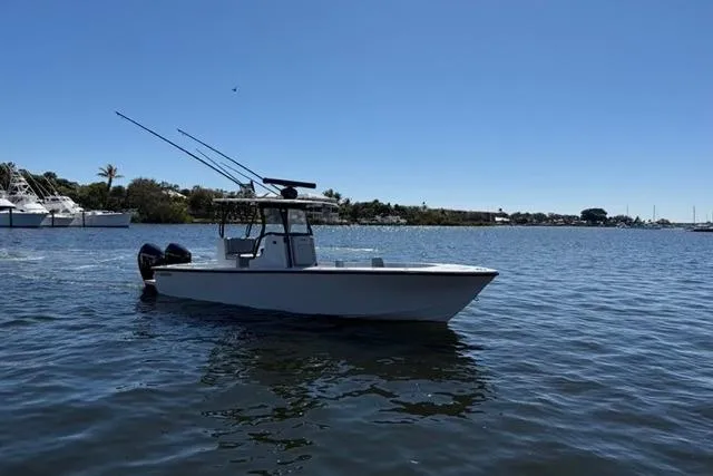 Slide: The Image of 2026 Orion 29 boat on calm water under clear blue sky. - 21
