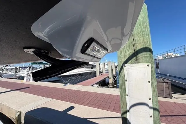 Slide: The Image of Underwater light on Orion 29 boat, docked at marina, clear blue sky. - 34