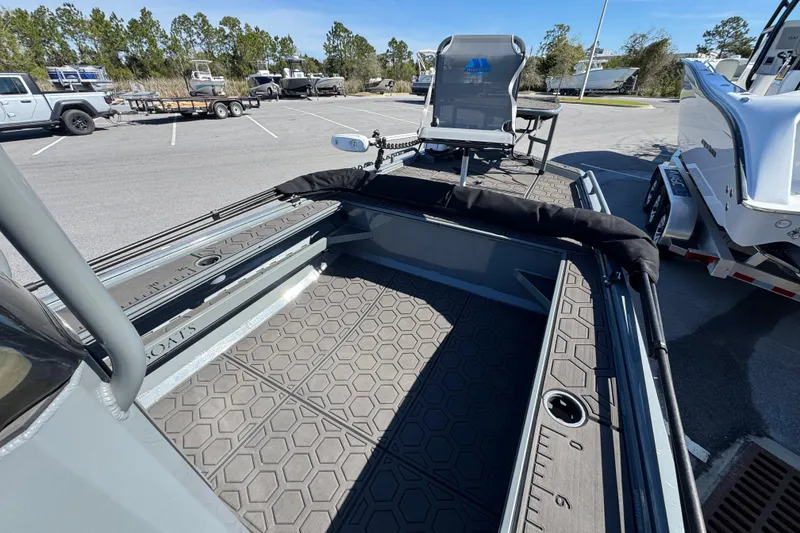 Slide: The Image of 2024 Prodigy 1960 Marsh Tuff boat with hexagonal deck pattern in parking lot. - 10