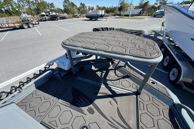 Slide: The Image of Deck of 2024 Prodigy 1960 Marsh Tuff boat in parking lot. - 12