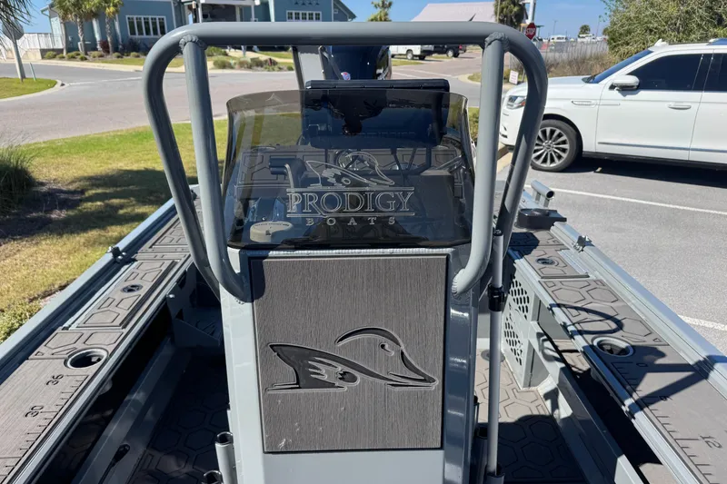 Slide: The Image of 2024 Prodigy 1960 Marsh Tuff boat interior with logo and steering console. - 14