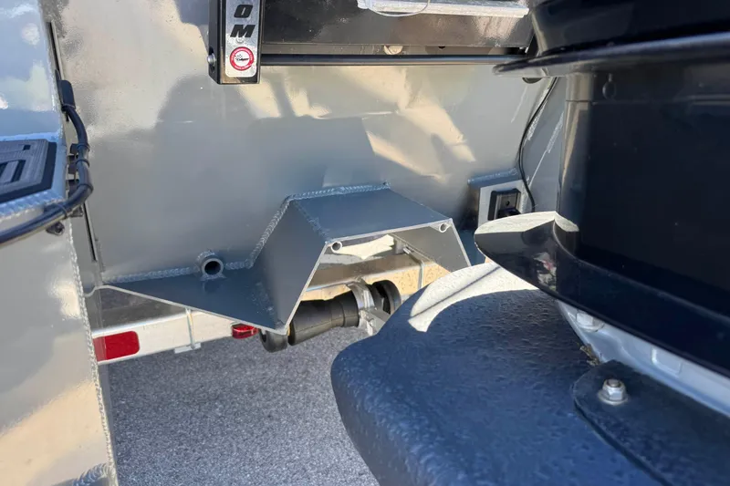 Slide: The Image of Close-up of 2024 Prodigy 1960 Marsh Tuff boat's engine mount and hull details. - 17