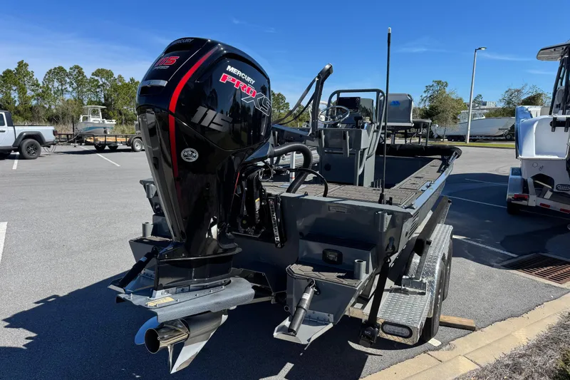 Slide: The Image of 2024 Prodigy 1960 Marsh Tuff boat with Mercury Pro XS engine in parking lot. - 5