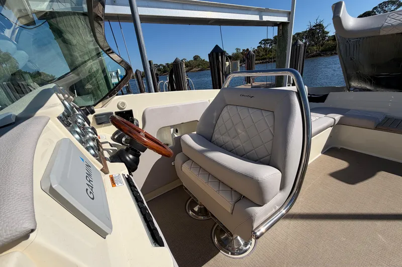 Slide: The Image of 2019 Chris-Craft Launch 30 helm with luxurious seating and Garmin navigation system. - 15