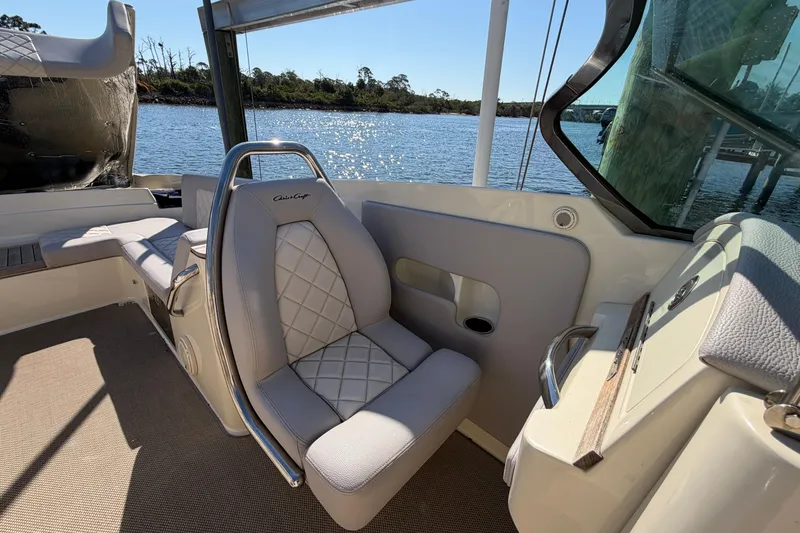 Slide: The Image of 2019 Chris-Craft Launch 30 boat interior with luxurious seating and scenic water view. - 16