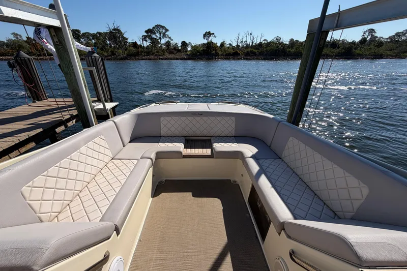 Slide: The Image of 2019 Chris-Craft Launch 30 boat interior with luxurious seating and scenic water view. - 20
