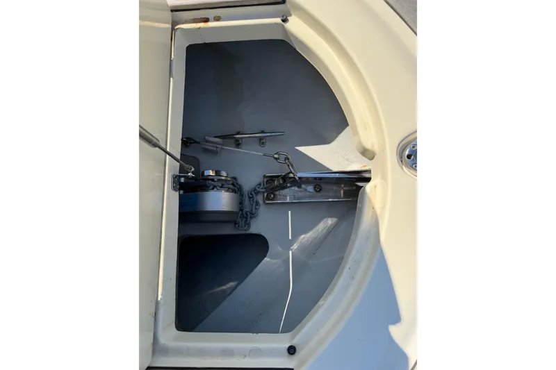 Slide: The Image of Anchor compartment of 2019 Chris-Craft Launch 30 boat, featuring chain and winch. - 22
