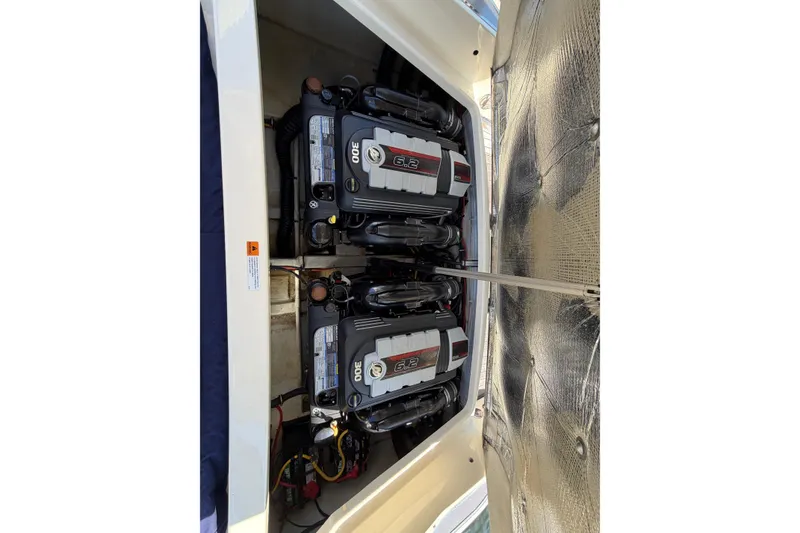 Slide: The Image of 2019 Chris-Craft Launch 30 engine compartment with dual 6.2L engines. - 8