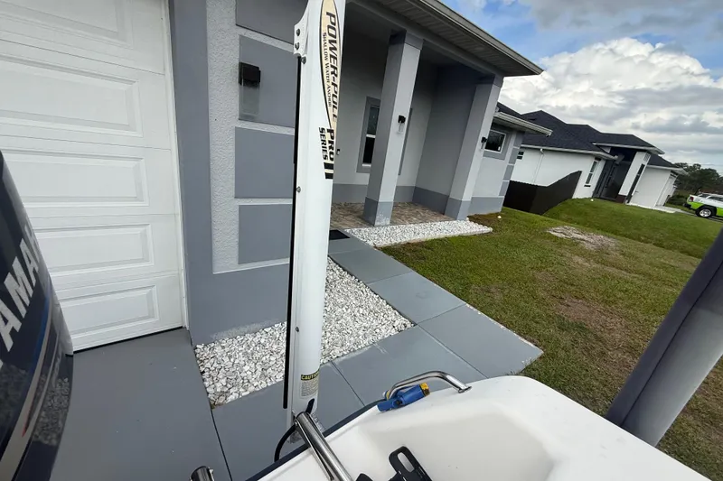 Slide: The Image of 2005 Sea Hunt Triton 232 boat interior with steering console and seating. - 15