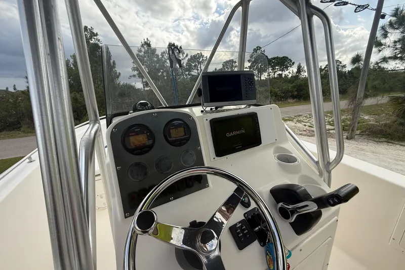 Slide: The Image of Control panel of a 2005 Sea Hunt Triton 232 boat with navigation equipment. - 16