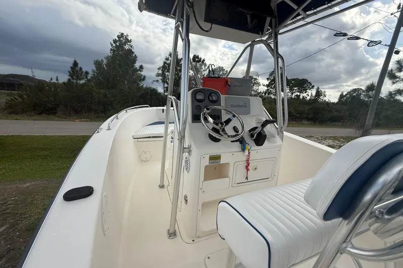 Slide: The Image of Control panel on a 2005 Sea Hunt Triton 232 boat, featuring up and down buttons. - 17