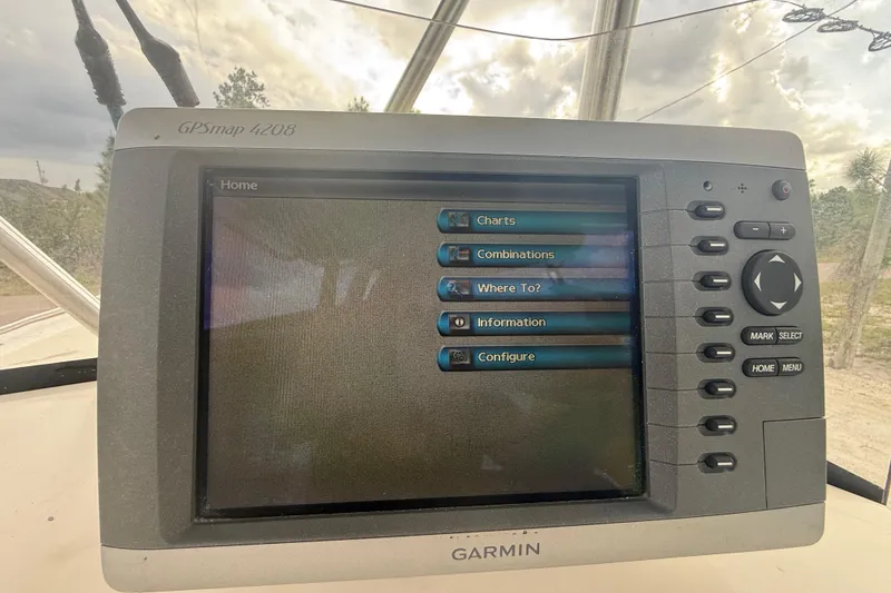 Slide: The Image of Dashboard of a 2005 Sea Hunt Triton 232 boat with Yamaha gauges. - 21