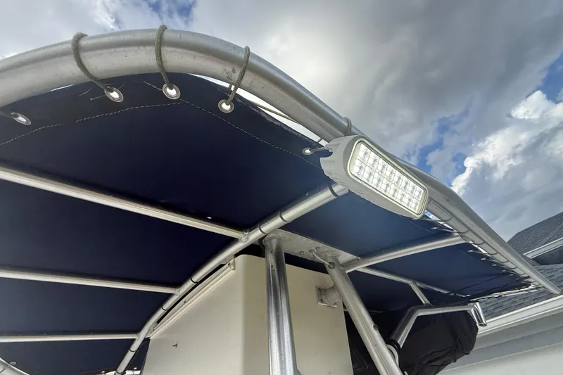 Slide: The Image of Open storage compartment on a 2005 Sea Hunt Triton 232 boat. - 31