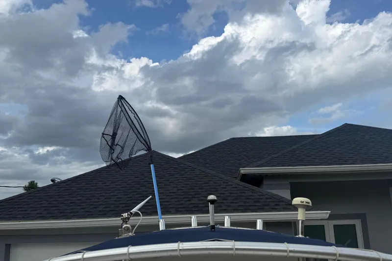 Slide: The Image of 2005 Sea Hunt Triton 232 boat interior with white and blue seating. - 32