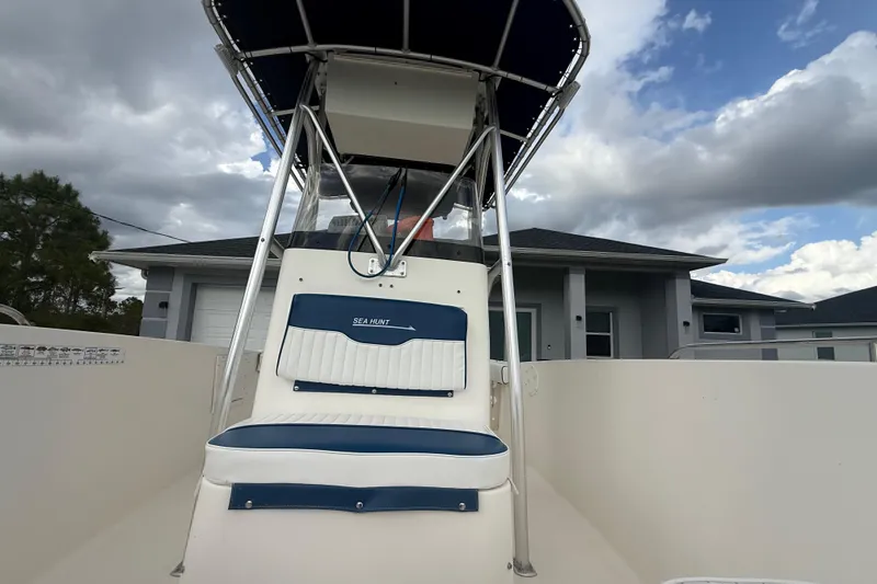 Slide: The Image of 2005 Sea Hunt Triton 232 boat interior with open storage compartments. - 38