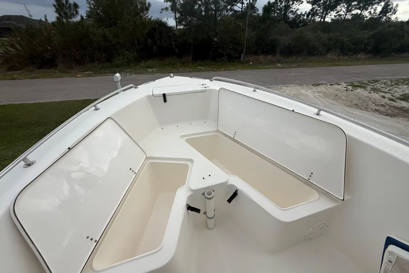 Slide: The Image of 2005 Sea Hunt Triton 232 boat interior with seating and railing details. - 40