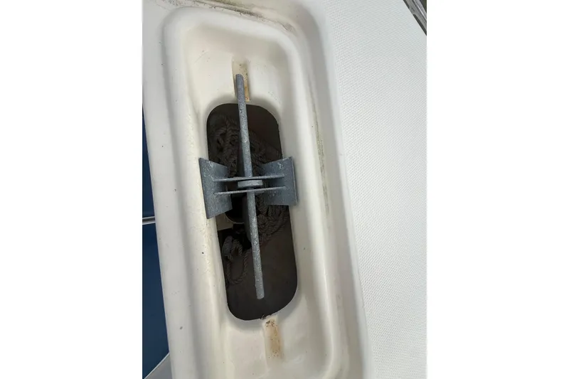 Slide: The Image of Interior view of a 2005 Sea Hunt Triton 232 boat compartment, showing storage space. - 41