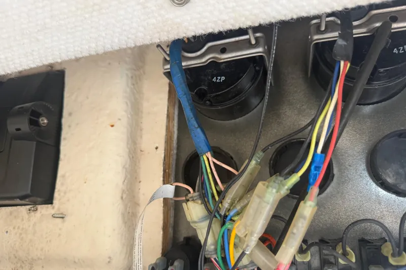 Slide: The Image of Interior view of a 2005 Sea Hunt Triton 232 boat compartment with wiring and equipment. - 45