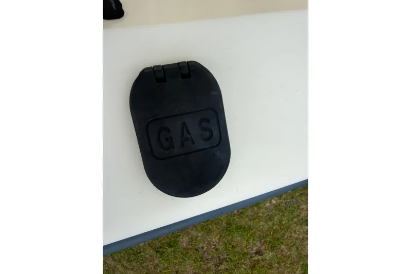 Slide: The Image of Control panel of a 2005 Sea Hunt Triton 232 boat with multiple switches. - 50