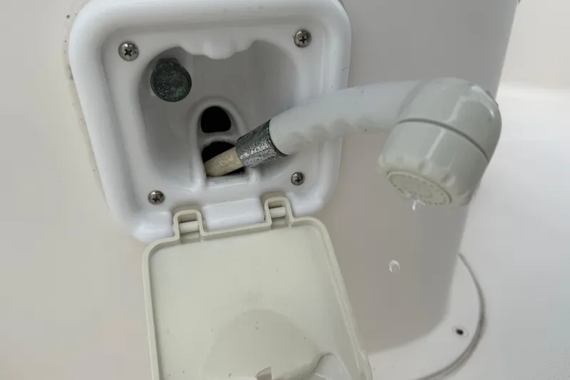 Slide: The Image of Close-up of a 2005 Sea Hunt Triton 232 boat's deck light and railing. - 53