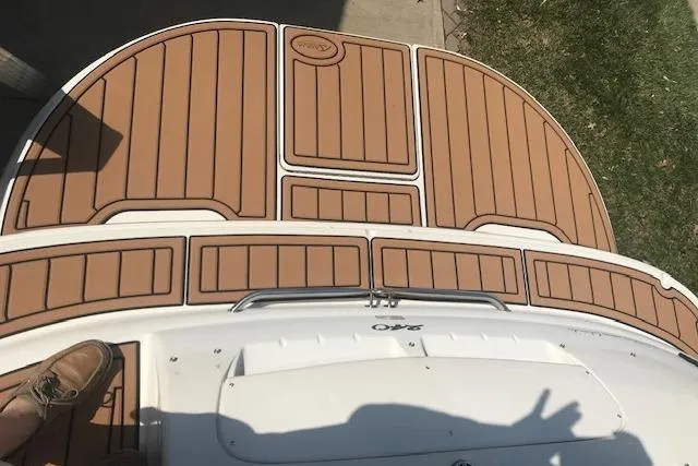 Slide: The Image of 2003 Sea Ray 240 Sundeck swim platform with teak-style decking. - 10