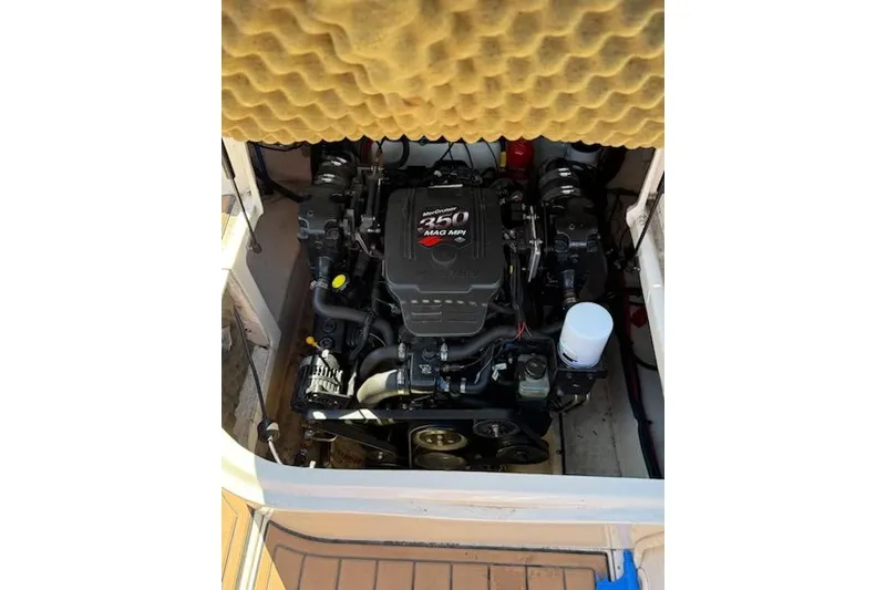 Slide: The Image of Engine compartment of a 2003 Sea Ray 240 Sundeck boat, featuring a 250 MAG MPI engine. - 8
