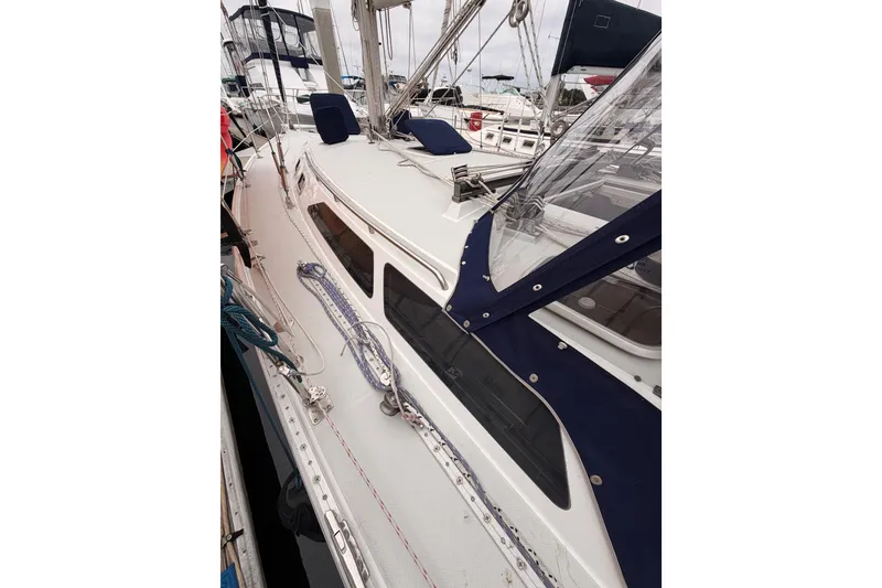 Slide: The Image of 1996 Catalina 36 MkII sailboat deck with blue canvas and rigging details. - 14