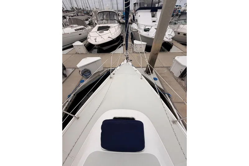Slide: The Image of Bow view of a 1996 Catalina 36 MkII sailboat docked at a marina. - 15
