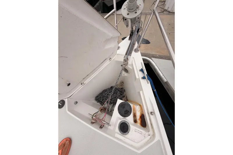 Slide: The Image of Anchor locker of a 1996 Catalina 36 MkII sailboat with chain and ropes. - 16